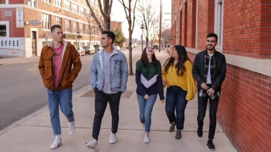 Group of students in a gap year program walking down the streets in Worcester, MA